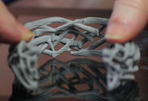 Cracks and full breaks are evident in the middle of the bracelet.