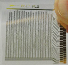 At the 2011 IEEE ISSCC conference researchers from the IMEC nanotechnology center in Belgium described how they made this processor from organic transistors deposited on a plastic foil. Its transistor count is roughly that of the Intel 4004 microprocessor developed 40 years before.